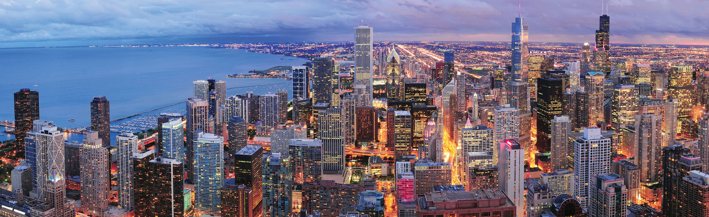 Chicago skyline at dusk, from Cushman & Wakefield’s Chicago office page
